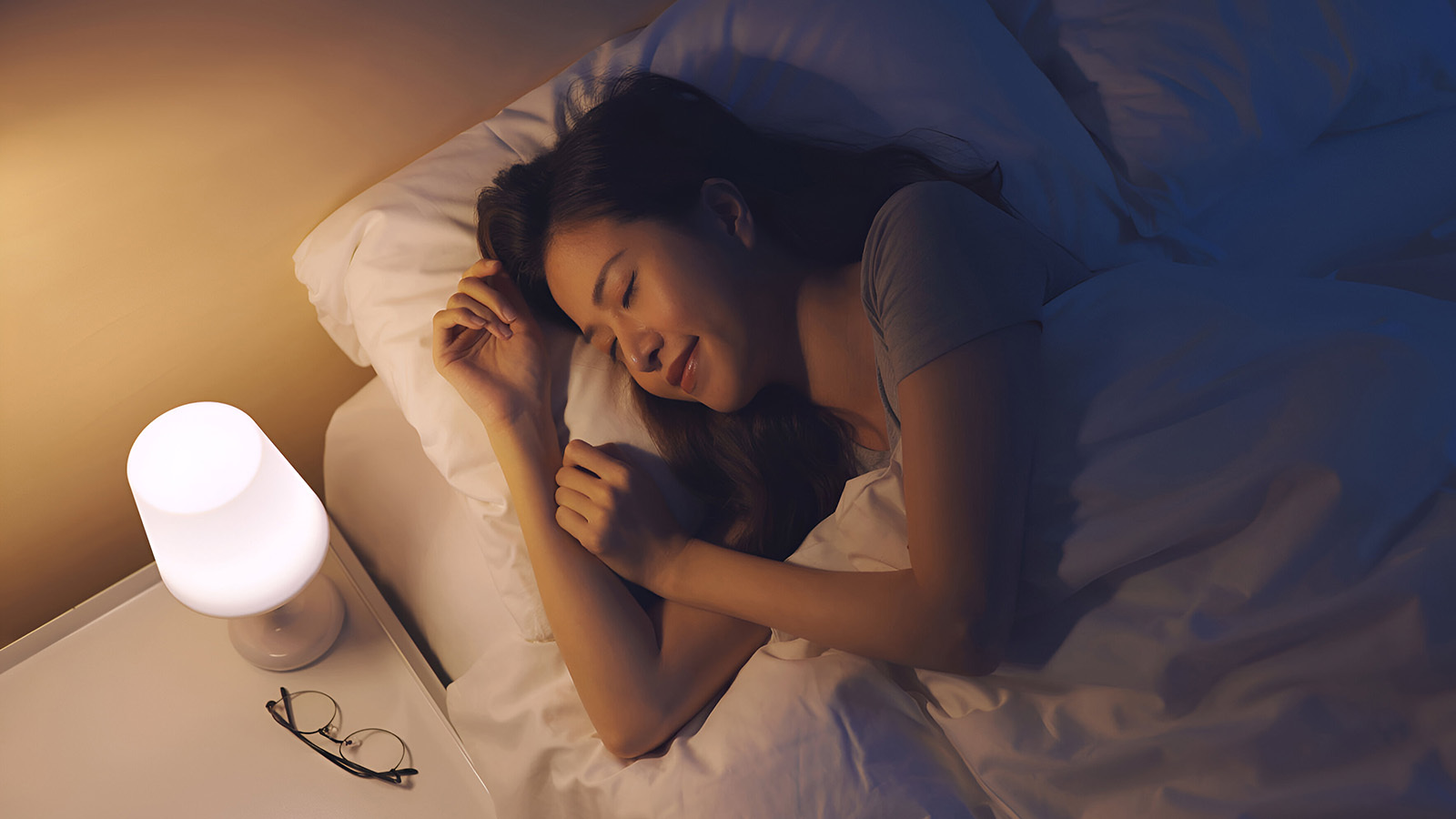 Woman sleeping soundly in her bed